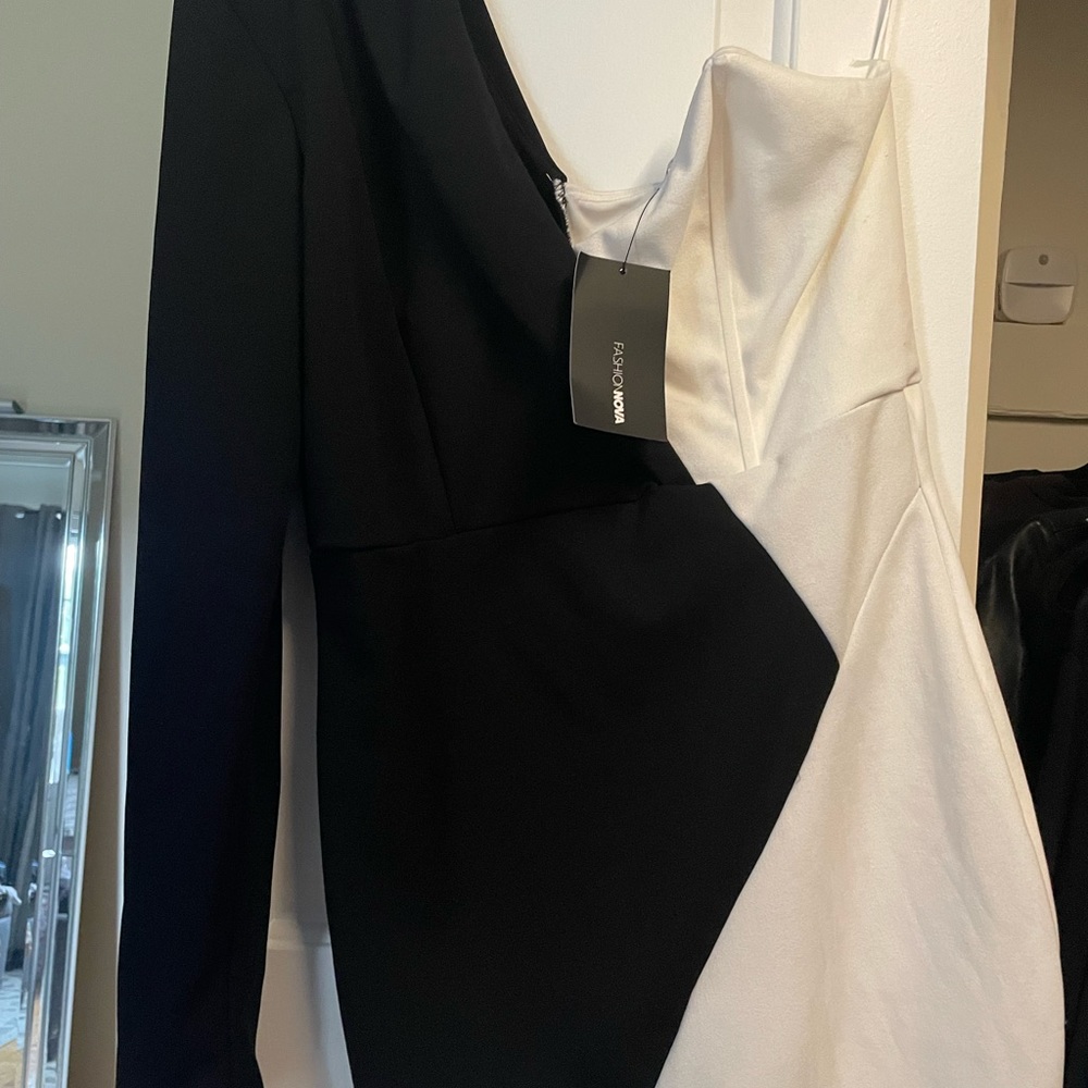 Fashion nova black and white dress. New with tag. Padding in right shoulder.